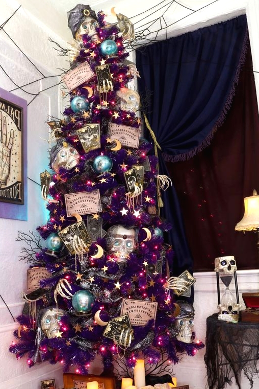 a purple Halloween tree with skeleton hands, skulls, cards and stars is a gorgeous and unique decoration