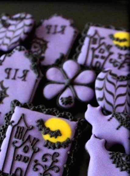 purple and black Halloween cookies are a perfect dessert for a party or can be given as favors at this party