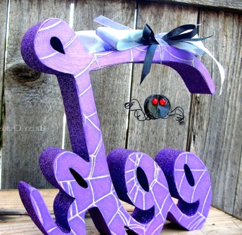 purple EEK letter decor with a spider is a very cool and bold solution to rock at a Halloween party or just in your home