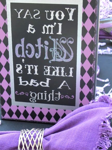 a black and purple Halloween sign is a cool solution to style your space for this spooky holiday