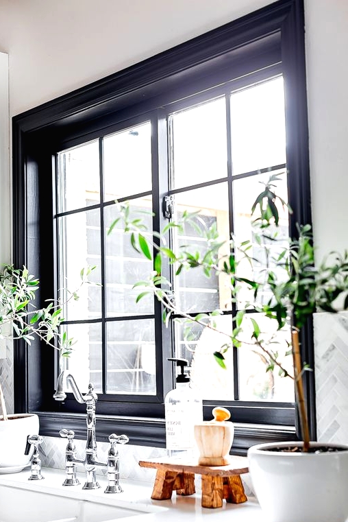 a chic black French window will bring light in and will make your space more refined, black touches create a dramatic feel