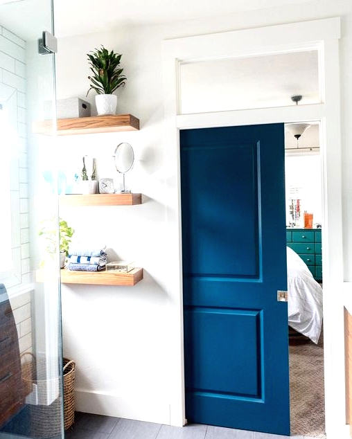 a bold blue pocket doors with panes is an elegant way to add color and separate the spaces in a bold and statement way