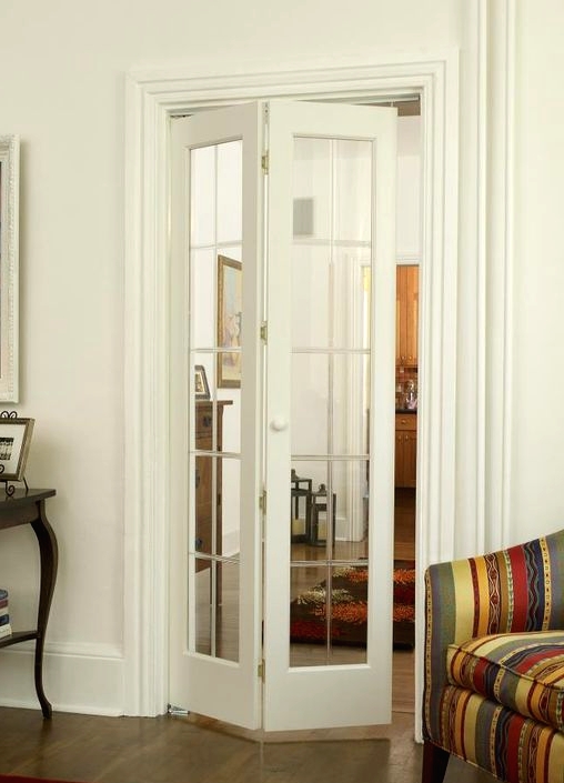 a mirror framed folding door is a lovely idea to separate the spaces from each other and even a small space doesn't look smaller with such a door