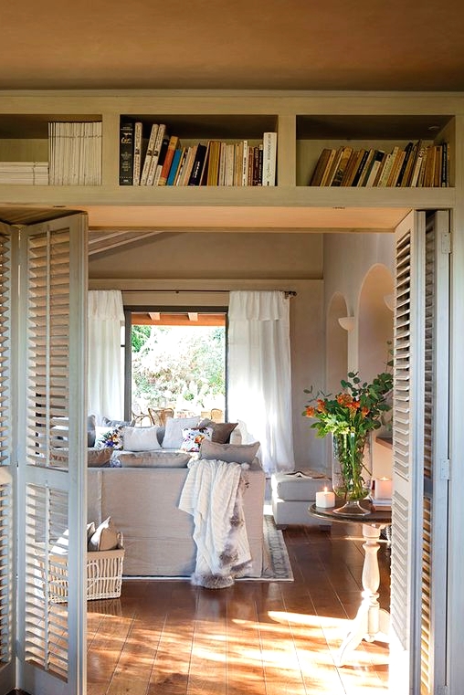 white shutter folding doors perfectly match the modern farmhouse style and delicately decorate the spaces