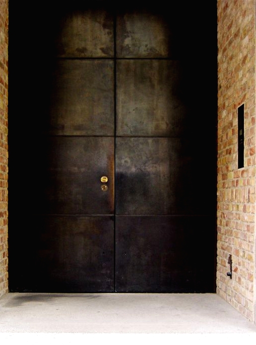 such blackened steel front doors are amazing as they make a statement with their look and keep your home safe - it's hard to break in through them