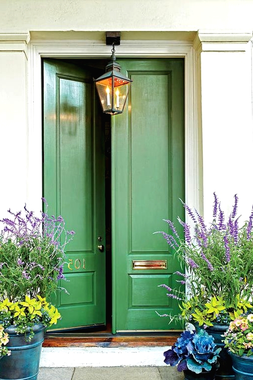 vintage doors made eye-catchy with just green paint and soem gold detailing are a great example of how to refresh your old doors