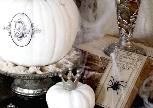 refined white Halloween pumpkins decorated with a black decal and a little crown for chic and beautiful Halloween decor