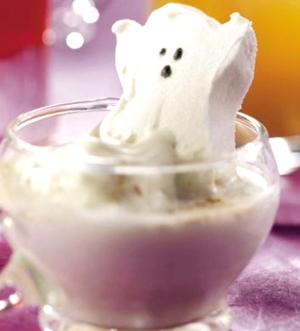 a drink accented with a marshmallow ghost is a cool idea for styling a white Halloween party including food and drinks