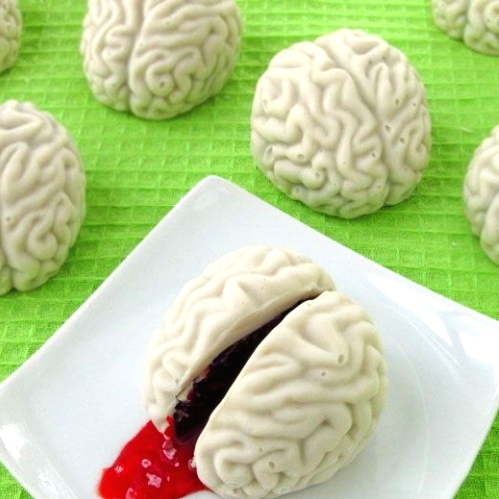 white Halloween sweets styled as brains, with blood inside are scary and stylish sweets for your white party