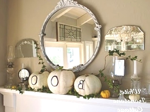 white pumpkins with black letters are amazing to style your mantel for Halloween and are very easy to make