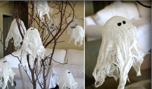 simple white cheesecloth ghosts can be used to decorate around the house and outdoors for Halloween