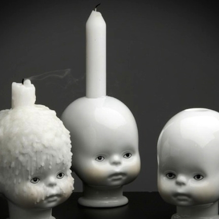 scary white doll heads as candleholders and white candles are amazing for spooky and statement white Halloween decor