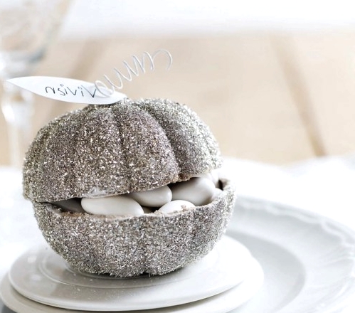 a silver glitter pumpkin with white candies inside is a lovely idea for a fall, Thanksgiving or white Halloween celebration