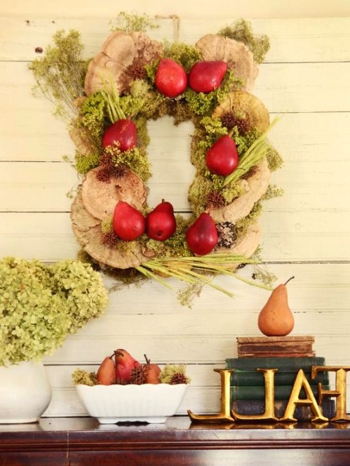 a true harvest wreath of wood slices, veggies, fruits and herbs is a fun and creative idea for Thanksigiving