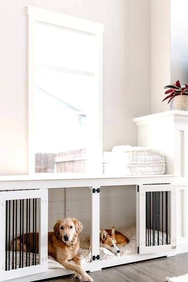 a long and low dog crate made of a cabinet is suitable for two dogs at a time and looks pretty and airy