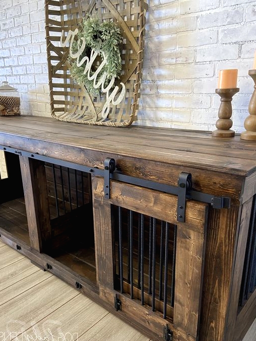 a rich-stained two dog kennel with a sliding door doubles as a console table is a very cool idea for an industrial space