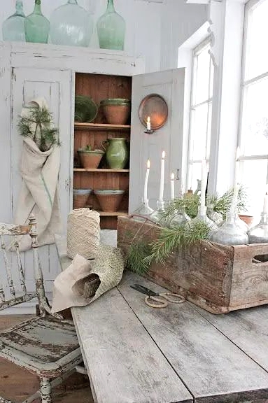 a whitewashed planked storage unit with shelves and decor is a lovely idea for a Scandi space or for a shabby chic one