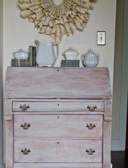 a whitewashed vintage storage unit on casters and with vintage pulls is a lovely idea for a chic dining room or entryway