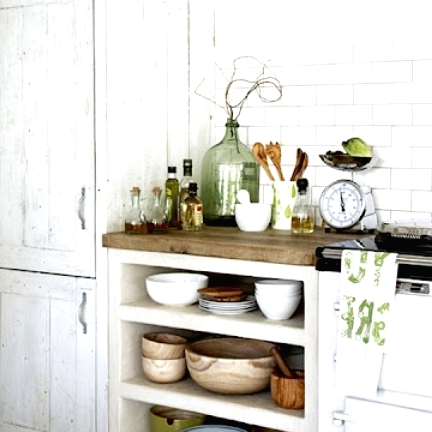 a beautiful whitewashed storage unit is a lovely idea for a shabby chic or Scandinavian kitchen like this one