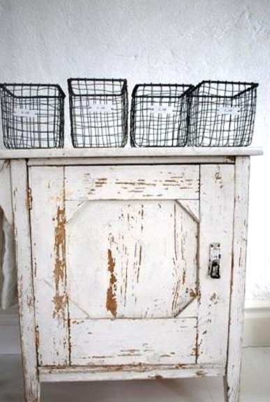 a shabby chic whitewashed cabinet is a lovely and relaxed idea for a shabby chic or vintage space