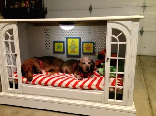 a vintage cabinet transformed into a double dog bed, with light, pics and pillows and toys is a cool DIY project