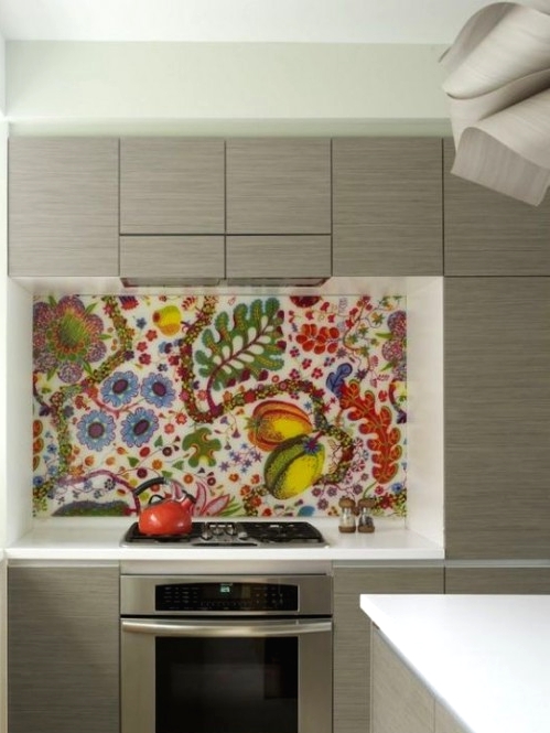 a sleek grey kitchen with a super colorful floral and fruit backsplash and white countertops is a fun and cool idea for a modern space