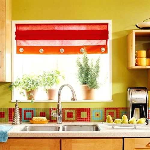 a colorful kitchen with mustard walls, sleek stained cabinets, a stone countertop and a bright mosaic tile backsplash plus a bright curtain is fun and cheerful