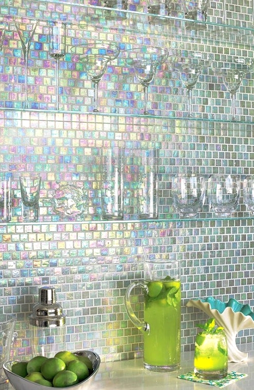 an iridescent mosaic tile backsplash, glass shelves and glasses not to prevent a viewer from enjoying these beautiful shades of the backsplash