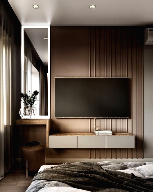 a refined taupe bedroom with paneling, a floating storage unit and a TV, a leather stool and a comfortable bed is amazing