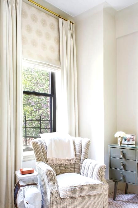 a neutral nursery with printed shades and creamy draperies that are classic for more of neutral rooms in various styles