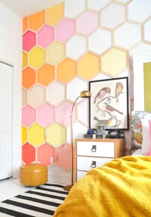 a bold bedroom done with a colorful honeycomb accent wall is a bright and cool idea to rock, it will add both color and pattern