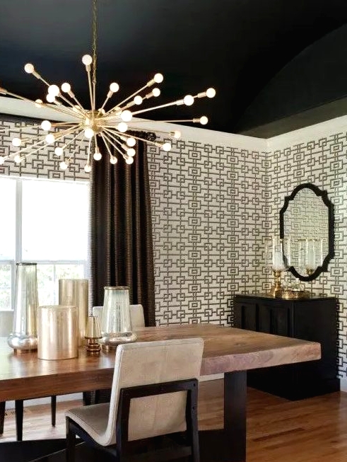 refined geometric wallpaper creates an ambience in this room and exquisite furniture finishes off the look