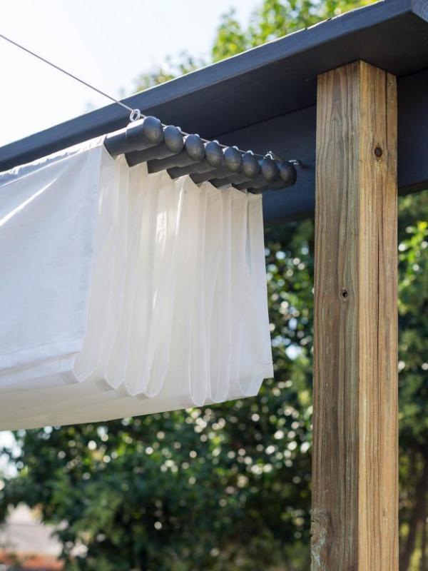 This DIY Backyard Canopy gives you the option of letting the sun in, or creating a shaded area. 